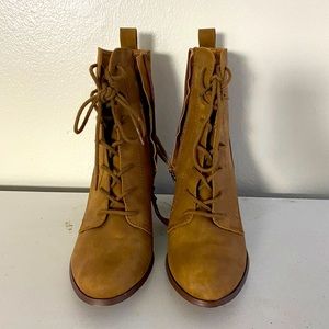 Never worn outside, tan boots. Heels about 2-3 inches of height.